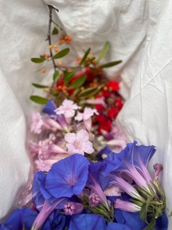 coloured flowers in a basket