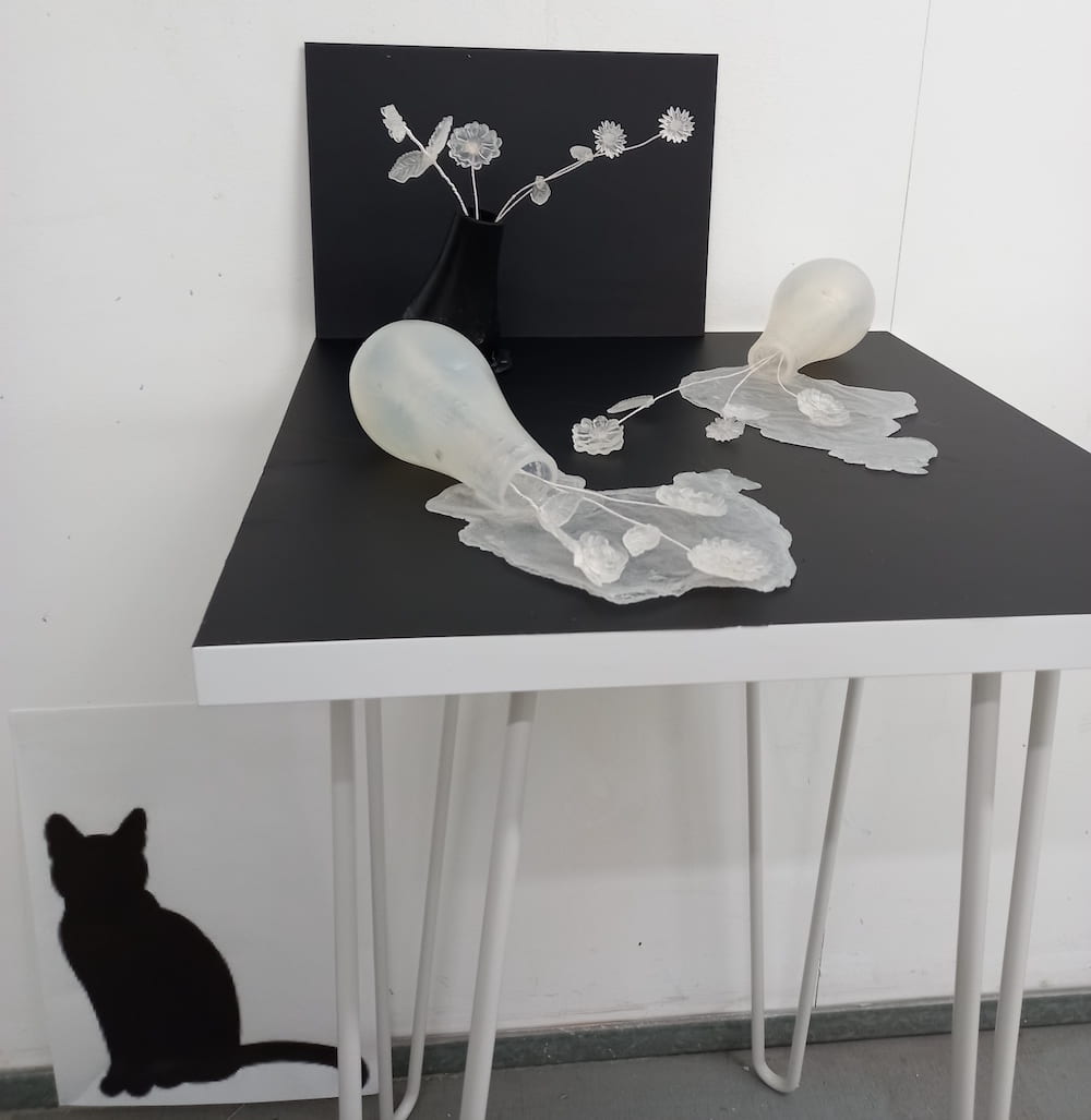 Black & white table with glass like items on top