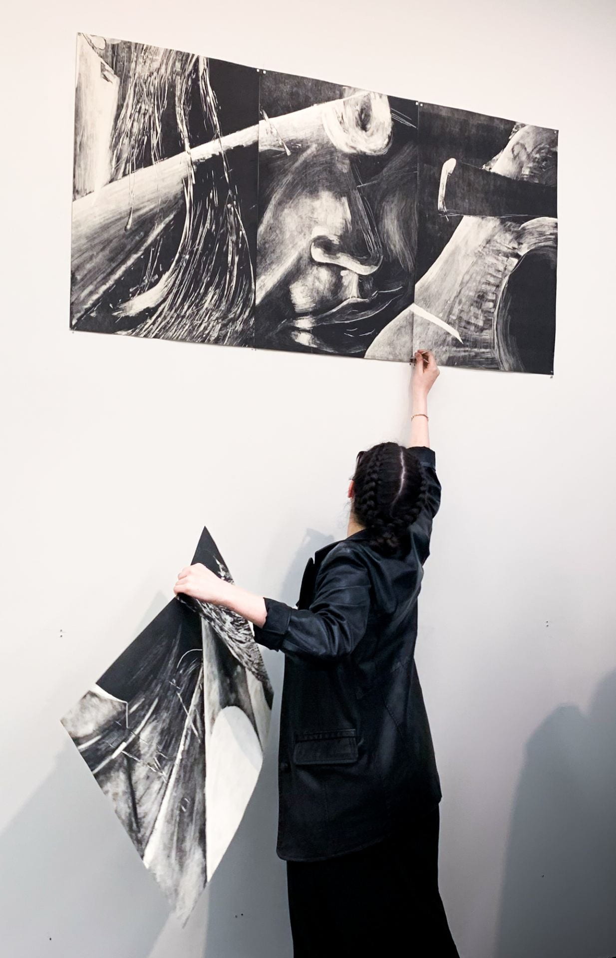 Jana Papantoniou, installing 'Two Figures Interwoven,' 2.25 x 1.48m. 