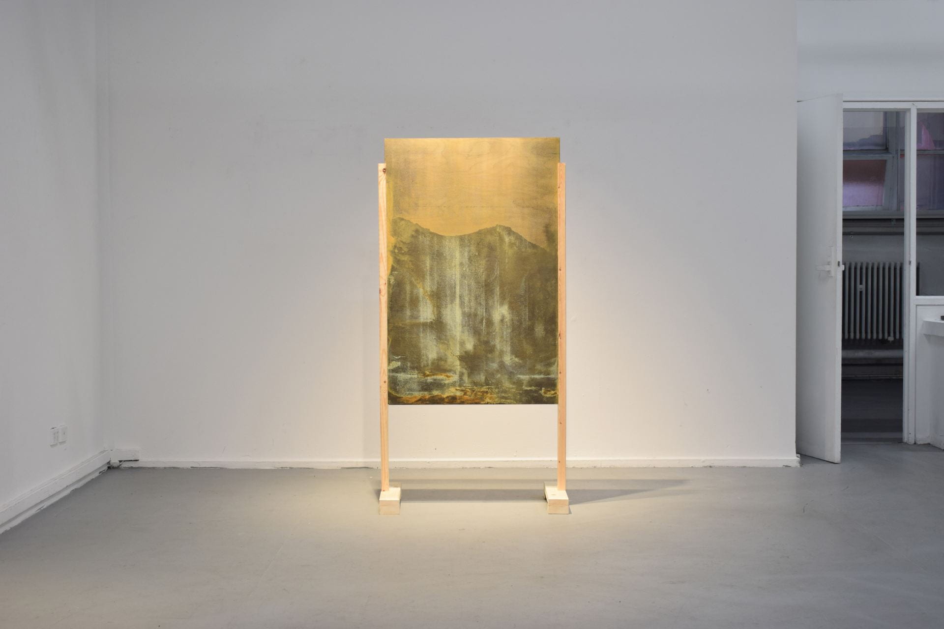 Installation view of 'corroded' screenprint onto plywood within a standing frame