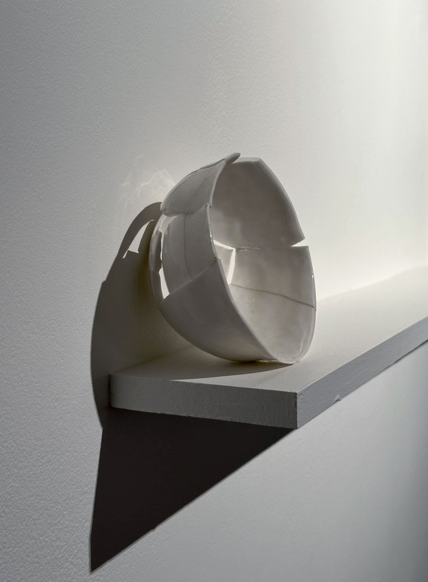 Chiara Zeta, 'Shattered" 2023, detail (installation view), broken porcelain bowl, flexible putty, photo Chiara Zeta