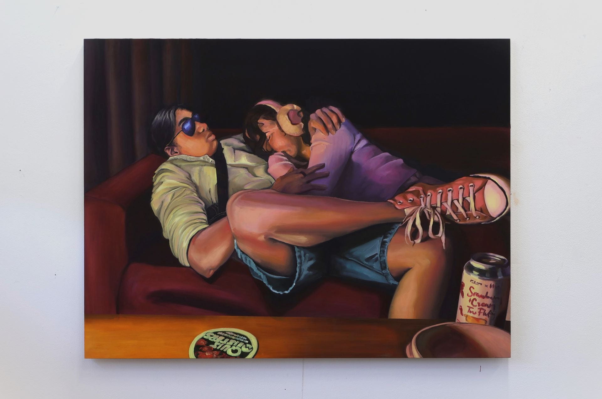 A painting of two people sleeping on a couch in a pub