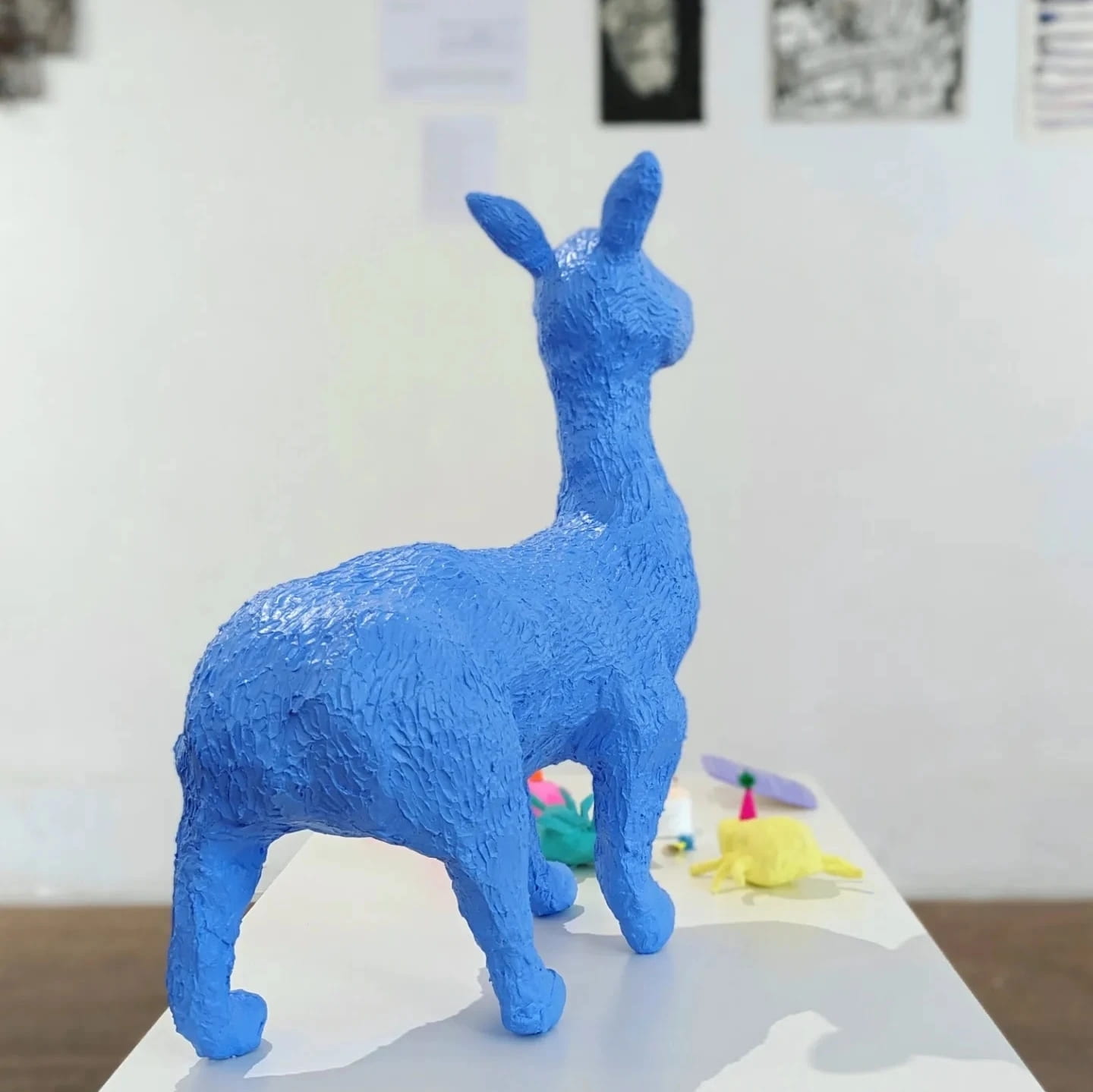 sculpture of a hybrid animal in bright blue