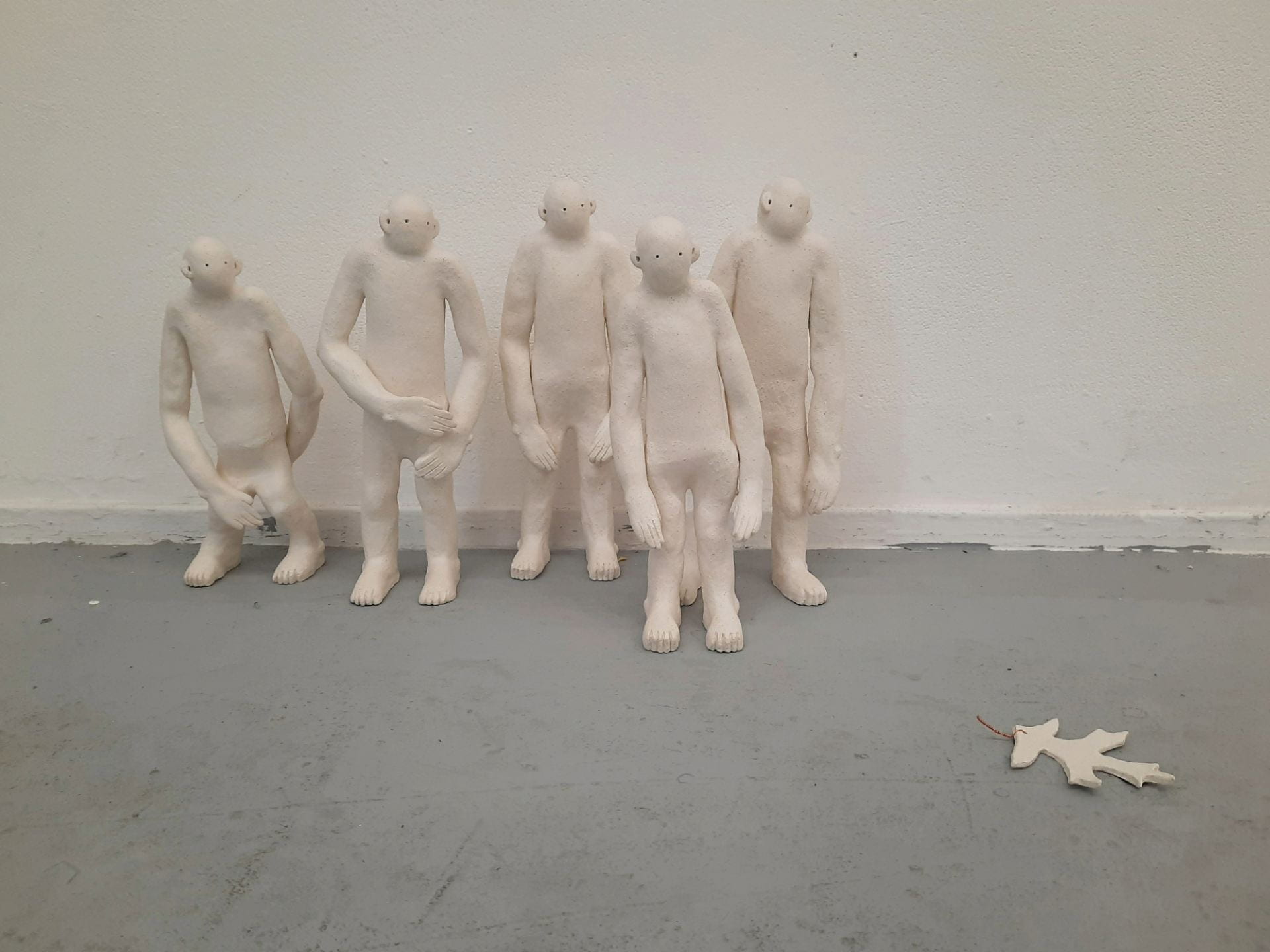 five human figures sculptures